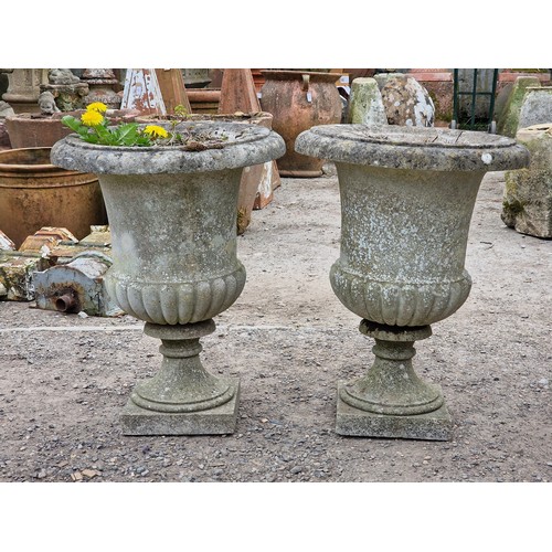 152 - Well cast weathered reconstituted stone garden urns with lobed bowls and flared rims, H 69cm x W 52c... 