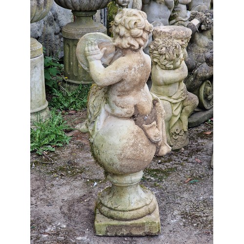 158 - Well weathered reconstituted stone garden statue of a musical cherub seated on a ball pier cap playi... 