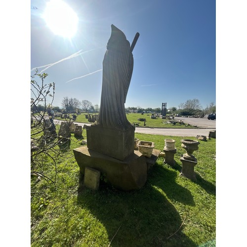 670 - Remarkable and large hand carved natural stone carving of the Grim Reaper with good detail, on subst... 