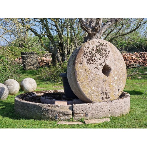 672 - Monumental antique natural stone cider press and mill stone, the base 250cm dia, the mill stone 130c... 