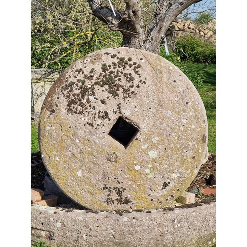 672 - Monumental antique natural stone cider press and mill stone, the base 250cm dia, the mill stone 130c... 