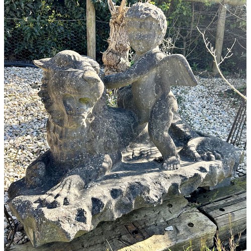 677 - Impressive antique York stone sculpture of a cherub and recumbent lion, H 90cm x W 125cm

Situated a... 