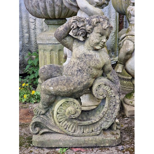155 - Weathered reconstituted stone garden statue of a seated cherub clutching a bundle of flowers, H 76cm... 