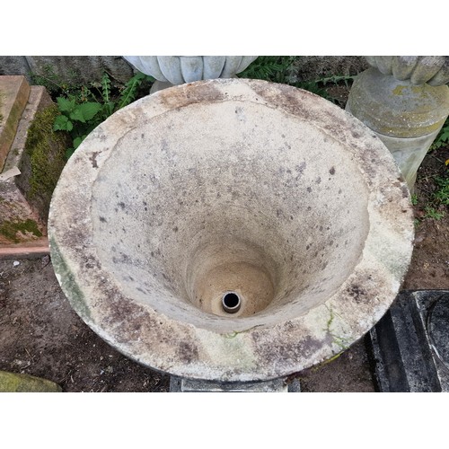 166 - Pair of weathered reconstituted stone garden urns with flared rims and chamfered square cut plinths,... 