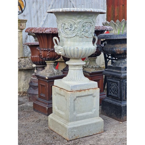 173 - After Andrew Handyside - Antique cast iron garden urn with scrolling floral relief and face mask det... 