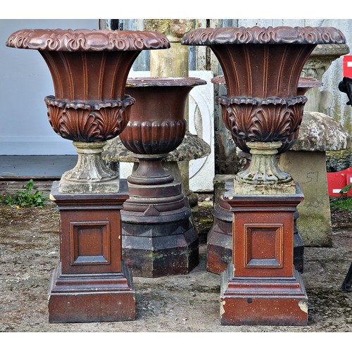 172 - Pair of salt glazed garden urns with acanthus leaf bowls and fluted detail, raised on square cut pli... 