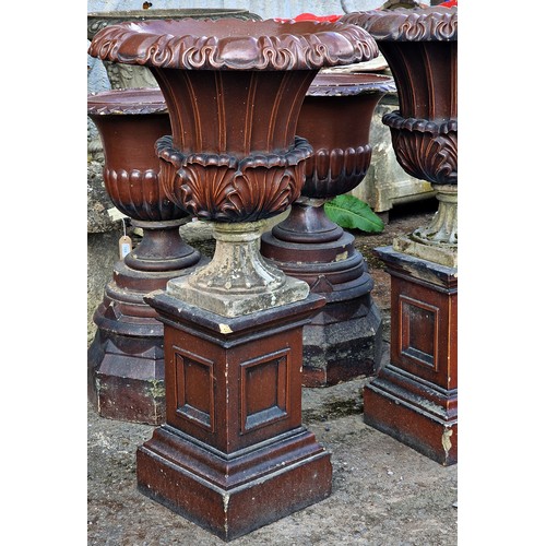 172 - Pair of salt glazed garden urns with acanthus leaf bowls and fluted detail, raised on square cut pli... 