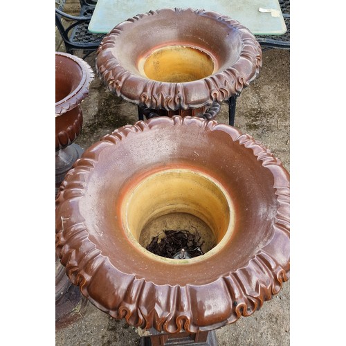 172 - Pair of salt glazed garden urns with acanthus leaf bowls and fluted detail, raised on square cut pli... 