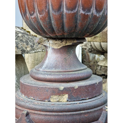 171 - Pair of salt glazed garden urns with lobed bowls and flared darted rims, raised on octagonal plinths... 