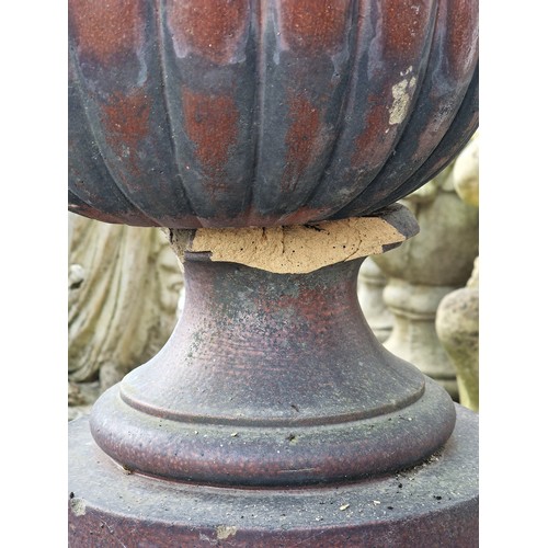 171 - Pair of salt glazed garden urns with lobed bowls and flared darted rims, raised on octagonal plinths... 