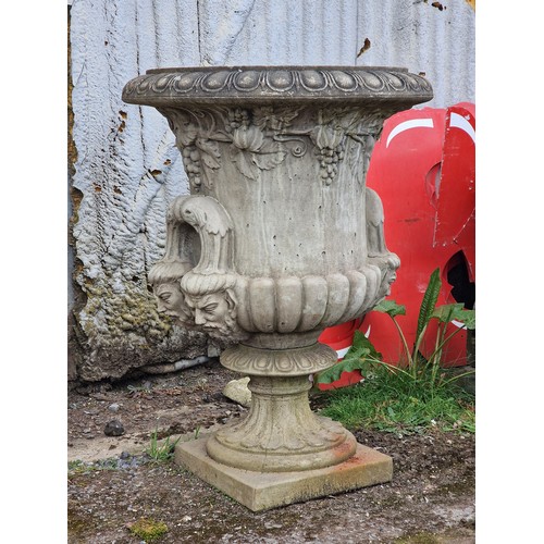 168 - Large reconstituted stone garden urn with fruiting grape vine relief, egg and darted rim and face ma... 