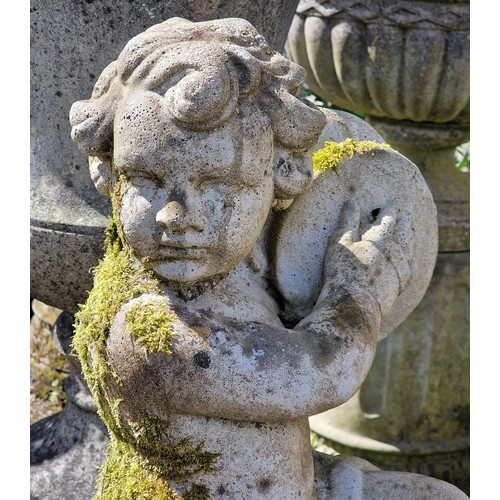 159 - Pair of weathered reconstituted stone garden statues of musical cherubs seated on ball pier caps, on... 