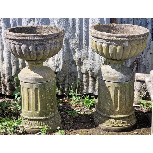 161 - Haddonstone - Set of four weathered reconstituted stone garden urns with lobed bowls, raised on flut... 