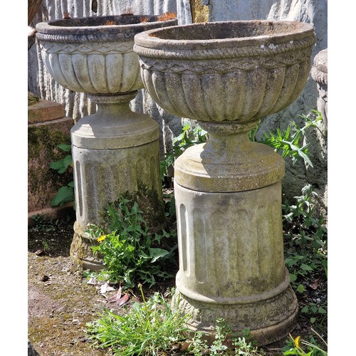 161 - Haddonstone - Set of four weathered reconstituted stone garden urns with lobed bowls, raised on flut... 