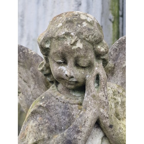 164 - Weathered marble angel statue raised on a reconstituted stone plinth, H 96cm x W 31cm x D 25cm