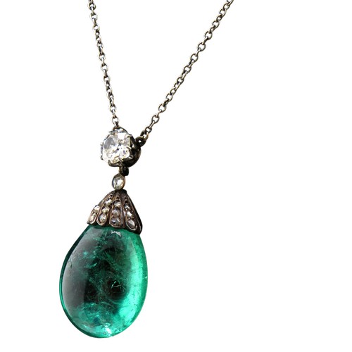 4 - An antique emerald and diamond pendant necklace, the drop-shaped emerald suspended from a rose diamo... 