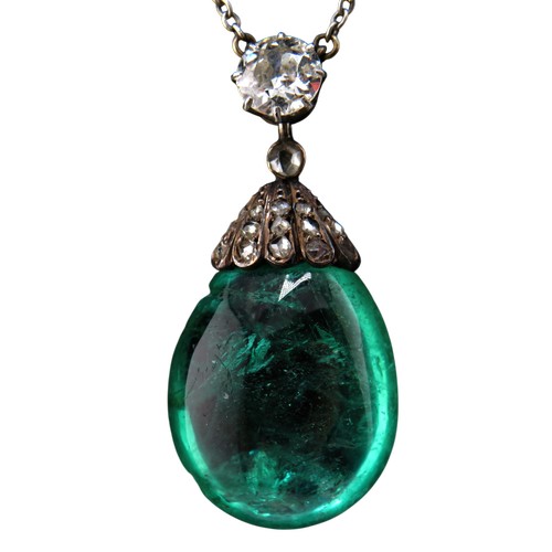 4 - An antique emerald and diamond pendant necklace, the drop-shaped emerald suspended from a rose diamo... 