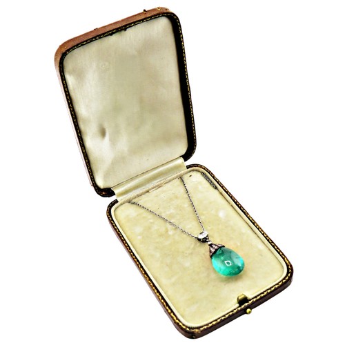 4 - An antique emerald and diamond pendant necklace, the drop-shaped emerald suspended from a rose diamo...