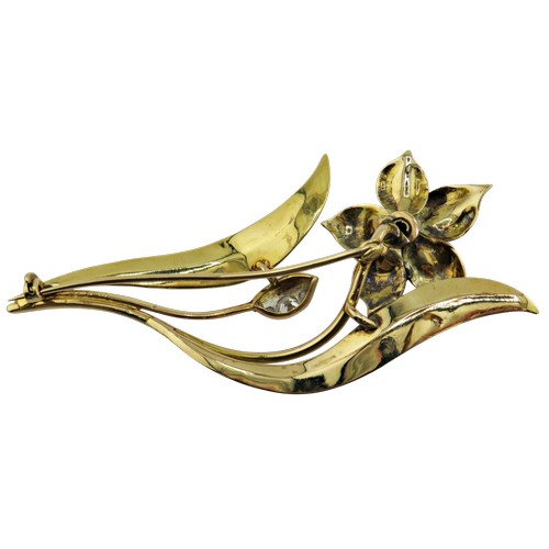 9 - A vintage diamond floral spray brooch set with a flower-head cluster of seven old-cut diamonds and a... 
