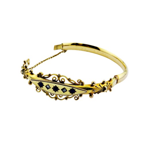 14 - A late Victorian gold sapphire and rose diamond hollow hinged bangle, set with three sapphires and t... 