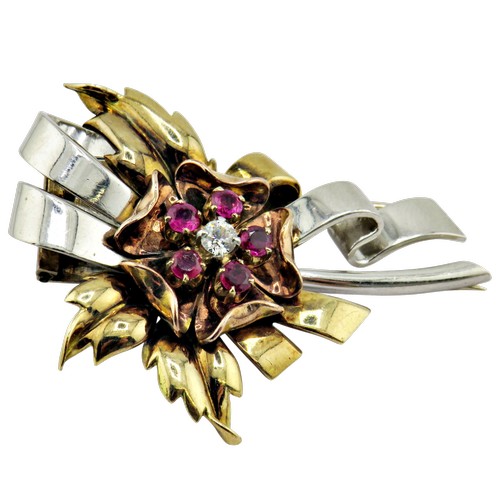 18 - A mid 20th century tri-colour gold, ruby and diamond clip brooch, the central rose-coloured flower-h... 