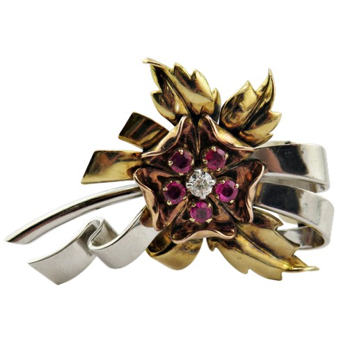 18 - A mid 20th century tri-colour gold, ruby and diamond clip brooch, the central rose-coloured flower-h... 