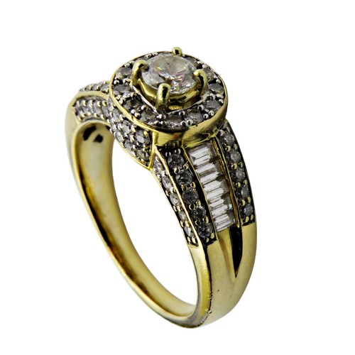 31 - A vintage Continental gold and diamond cluster dress ring, centred with a round brilliant diamond ap... 