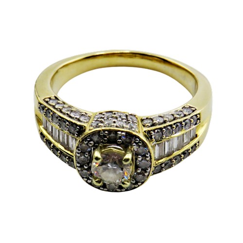 31 - A vintage Continental gold and diamond cluster dress ring, centred with a round brilliant diamond ap... 