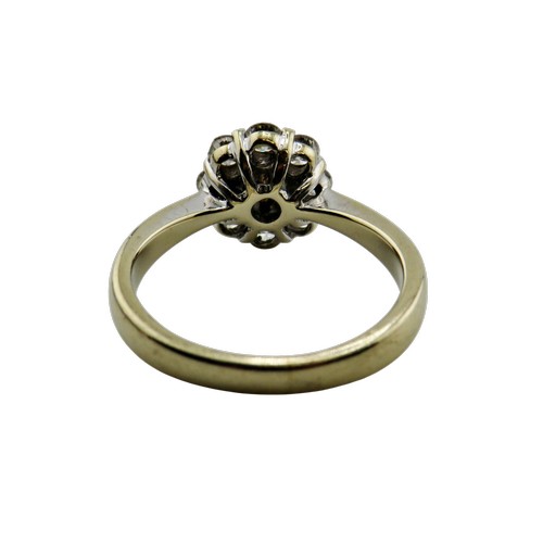 33 - An 18ct white gold and diamond oval cluster ring, centred with three bevel-edged baguette-cut diamon... 