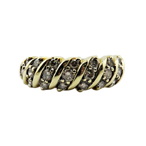 35 - A vintage gold and diamond half-eternity ring, the 21 small round brilliants grain set in trios with... 