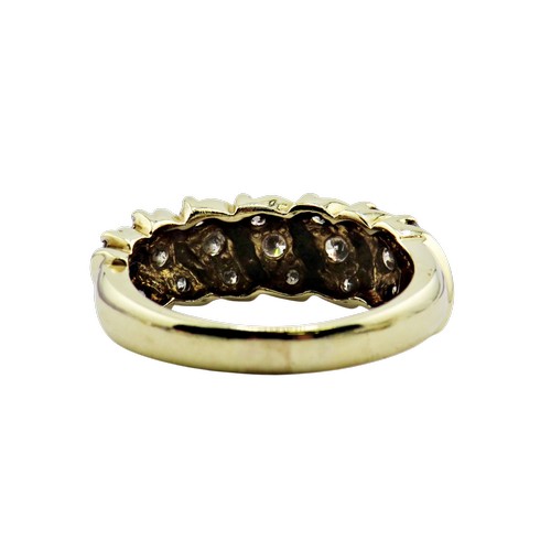 35 - A vintage gold and diamond half-eternity ring, the 21 small round brilliants grain set in trios with... 