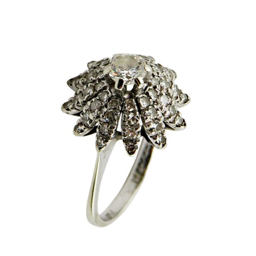36 - An 18ct white gold and diamond flower-head cluster ring, centred with a round brilliant approx. 0.25... 