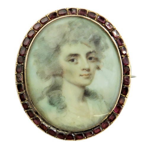 120 - A 19th century gold, flat-cut garnet and portrait miniature oval panel later adapted as a brooch wit... 
