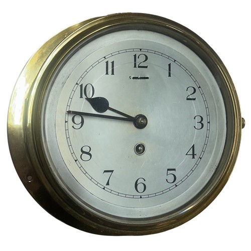 617 - An early 20th century maritime brass cased ships bulkhead clock, silvered dial with Arabic numerals ... 