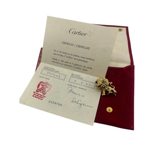 3A - Cartier - French gold and gem amusing lion brooch, number 945243, with a cabochon emerald eye and a ... 