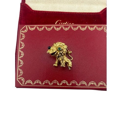 3A - Cartier - French gold and gem amusing lion brooch, number 945243, with a cabochon emerald eye and a ... 