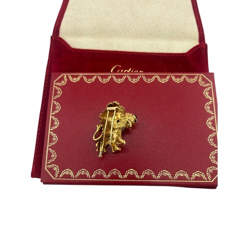 3A - Cartier - French gold and gem amusing lion brooch, number 945243, with a cabochon emerald eye and a ... 