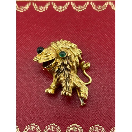3A - Cartier - French gold and gem amusing lion brooch, number 945243, with a cabochon emerald eye and a ... 