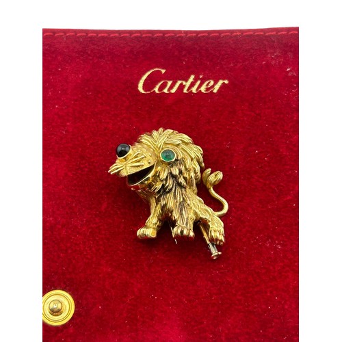 3A - Cartier - French gold and gem amusing lion brooch, number 945243, with a cabochon emerald eye and a ... 