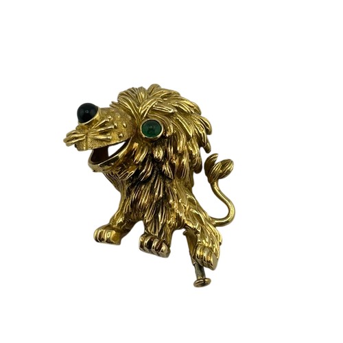 3A - Cartier - French gold and gem amusing lion brooch, number 945243, with a cabochon emerald eye and a ... 