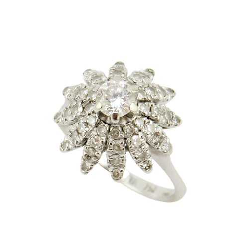 36 - An 18ct white gold and diamond flower-head cluster ring, centred with a round brilliant approx. 0.25... 