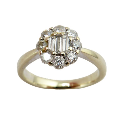 33 - An 18ct white gold and diamond oval cluster ring, centred with three bevel-edged baguette-cut diamon... 