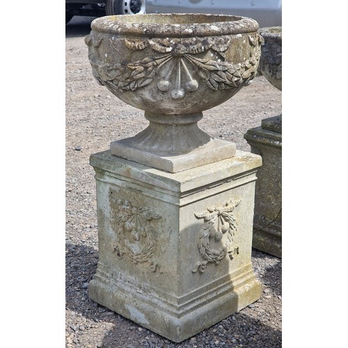 4 - Haddonstone - Pair of reconstituted stone garden urns with ornate foliate swag relief, raised on squ... 