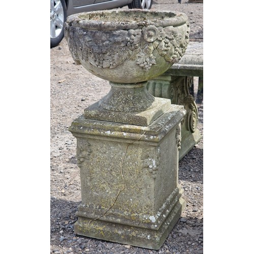 5 - Haddonstone - Pair of weathered reconstituted stone garden urns with grape vine relief, raised on sq... 