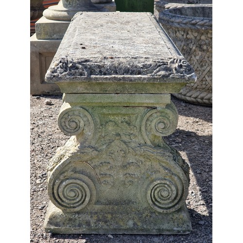 6 - Haddonstone - Weathered reconstituted stone pedestal bench with scrolled ends and floral relief, H 4... 