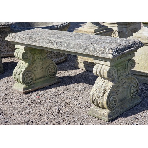 6 - Haddonstone - Weathered reconstituted stone pedestal bench with scrolled ends and floral relief, H 4... 