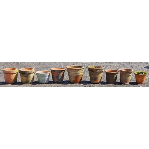 12 - Nine terracotta planters of various size and design, largest H 34cm x W 35cm (9)