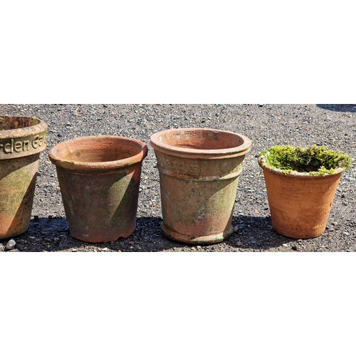 12 - Nine terracotta planters of various size and design, largest H 34cm x W 35cm (9)