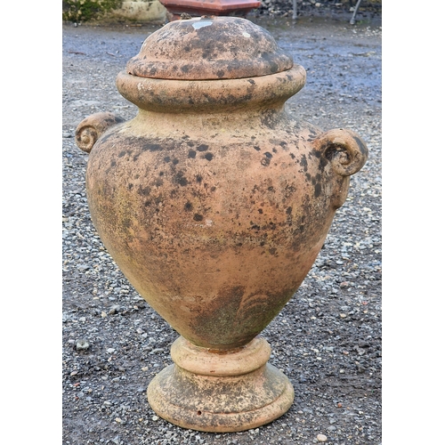 18 - Pair of terracotta twin handled lidded urns, H 60cm x W 47cm (2)