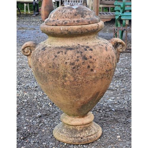18 - Pair of terracotta twin handled lidded urns, H 60cm x W 47cm (2)